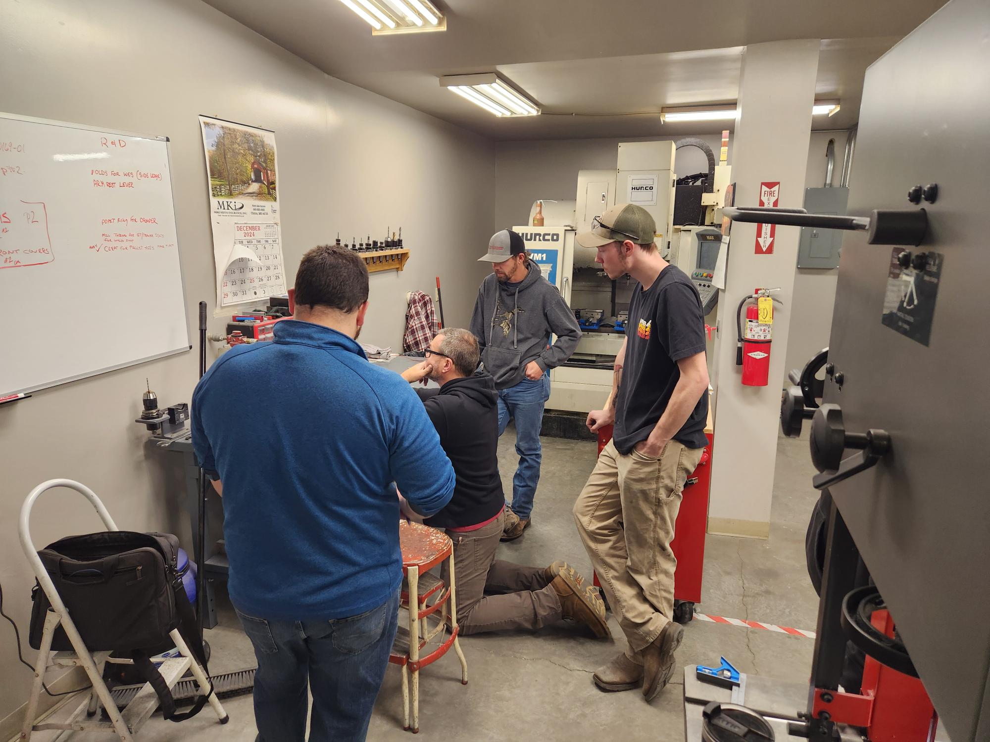 training session taking place in a workshop or manufacturing environment