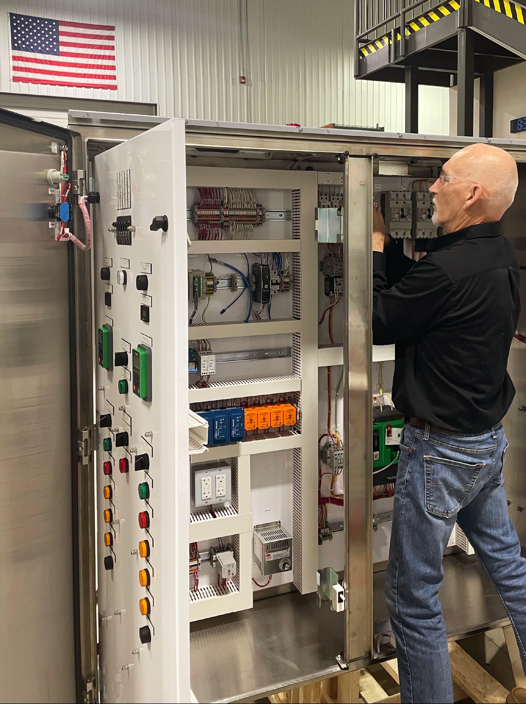working on an industrial control panel